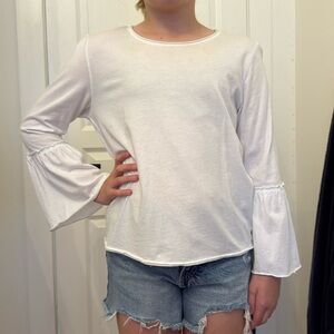 White long sleeve top with bell bottom sleeves
